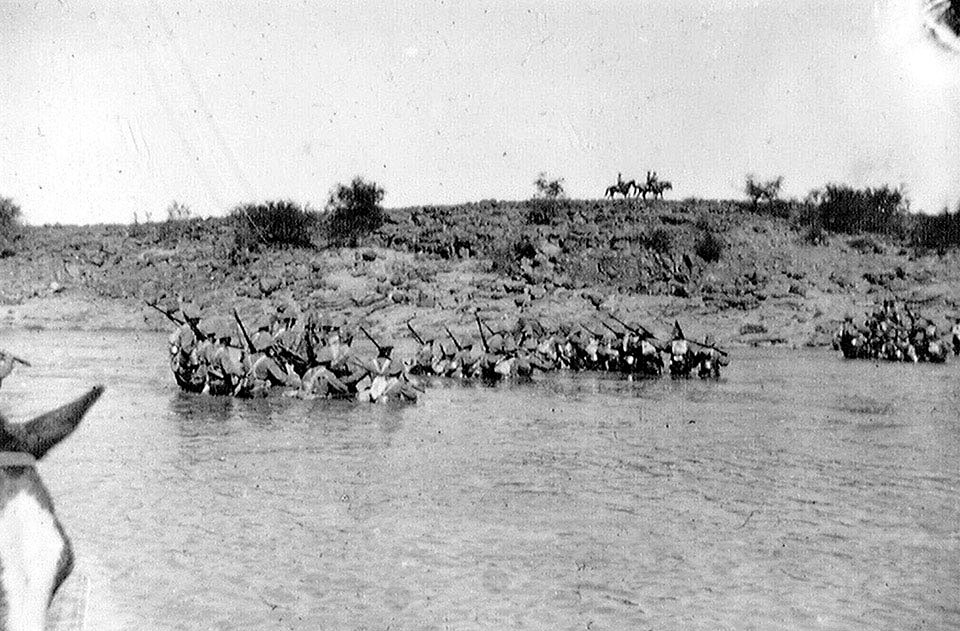 Canadian infantry crossing Paardeberg Drift at the Battle of Paardeberg on 27th February 1900 in the Great Boer War